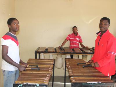 Youth learning how to play marimba